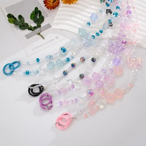 Colorful beaded phone lanyard featuring acrylic butterfly and flower charms with metal rings
