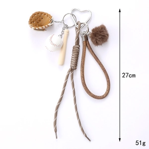 Baseball themed keychain set with leather glove and wooden bat on a brown woven rope