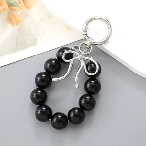Fashionable black bead keychain with silver metal bow pendant for bags and car keys