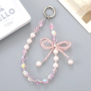 Pink iridescent crystal beads and pearl bow phone strap with silver round metal ring