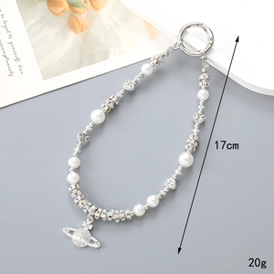 Saturn charm keychain with white pearls and sparkling crystals, 17cm length for women