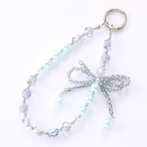 Handmade light blue pearl and crystal bead bag charm with a grey 3D woven bow design