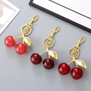 Three creative resin cherry keychains with gold metal rings for bags and car keys