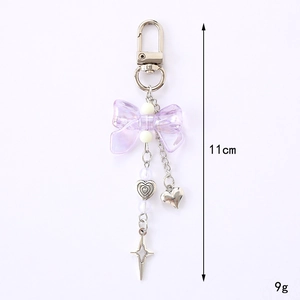 Korean style colorful bowknot keychain with silver heart and star charms on white background