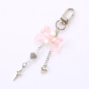 Pink holographic bow keychain with silver heart and star charms for phone or bags