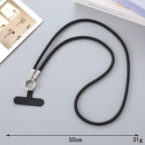 Detail view of black woven phone lanyard with rhinestone ring and connector pad