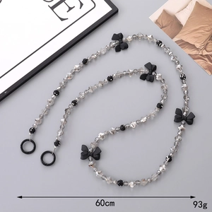Chic long beaded crossbody phone strap with dark grey crystals and black bow charm