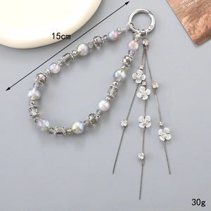 Bijou de téléphone perlé avec pompon fleur, longueur 15cm et fermoir à ressort
