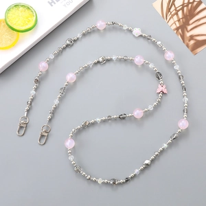 Pink butterfly beaded phone charm with white flower charms and silver lobster clasps