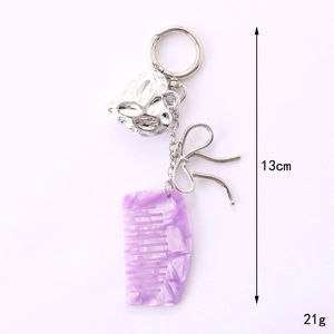 Acetate heart comb keychain with silver bow pendant, 13cm length and 21g weight