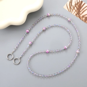 Detailed view of colorful crystal beaded chain with purple iridescent beads and spring clasp
