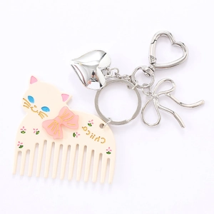 Sweet cream cat acetate hair comb keychain with pink bow and heart-shaped metal clasp