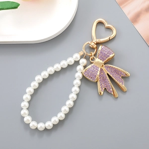 Pendentif nœud strass violet avec bracelet perles et fermoir cœur doré chic