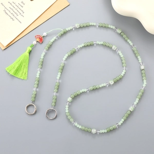 Beaded crossbody chain for bags with green crystal beads, tassels and fan charms