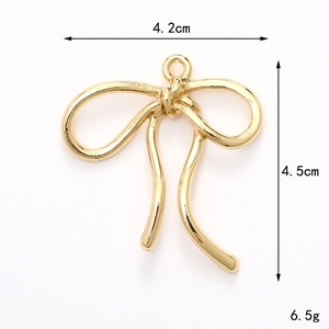 Detailed view of golden alloy bow pendant showing dimensions 4.2cm width and 4.5cm height
