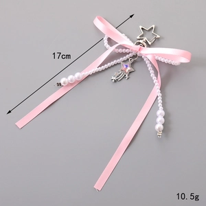 Pink satin bow keychain with white pearls and a colorful crystal star pendant, 17cm length