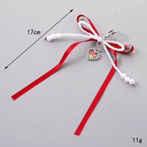 Bijou de sac à nœud rouge élégant avec perles blanches et pendentif fleur cœur