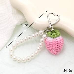 Handmade crochet strawberry keychain with pearls and heart clasp, 13cm length detail