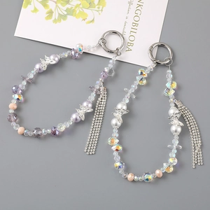 Elegant beaded keychain with pearl tassel and crystal butterfly charm for earphone case