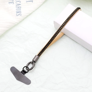 Brown leather phone wrist strap with sparkling black rhinestones and metal clip