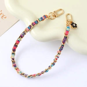 Colorful woven metal chain strap with gold lobster clasp and floral charm for handbags