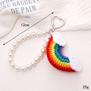Handmade crochet rainbow phone charm with pearl wrist strap and heart clasp