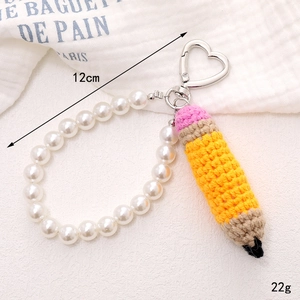 Handmade crochet pencil keychain with white faux pearl wrist strap and silver heart clasp