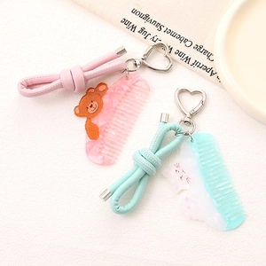 Charmant pendentif de téléphone nœud en cuir PU chaton et peigne à ours avec boucle