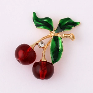 Exquisite cherry charm with red enamel fruit, green leaves, and a sparkling crystal accent