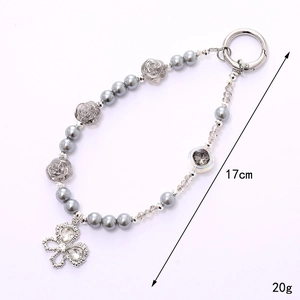 Elegant 17cm pearl phone charm with rose flower and sparkling butterfly pendant
