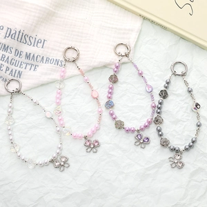 Beaded wrist phone strap with rose beads and rhinestone butterfly pendant in four colors
