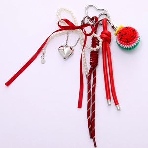 Handmade crochet watermelon and ribbon bow keychain charm with heart pendant and pearls