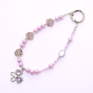 Elegant purple beaded phone strap with rose pearls and a silver butterfly charm pendant