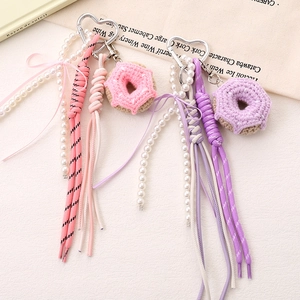 Handmade crochet donut bag charm with heart buckle, pearls and ribbon bow decoration