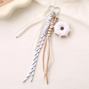 Handmade crochet donut bag charm with pearl bow and woven rope keychain for women