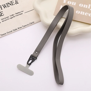 Grey PU leather phone lanyard with black matte clip and patch on white tray