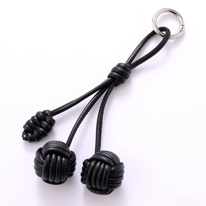Handmade black leather woven ball phone strap and bag charm with silver metal clasp