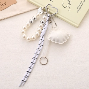 Elegant beaded shell phone charm with white faux pearls and heart keychain for women