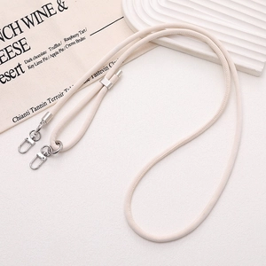 Detail of cream beige PU leather phone strap with silver alloy lobster clasps and metal slider