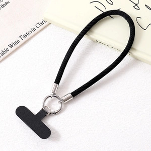 Detail of black woven PU leather phone wrist strap with silver ring and T-shaped insert