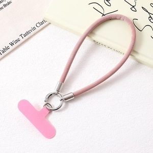 Detailed close-up of pink PU leather wrist strap with silver metal ring and phone connector