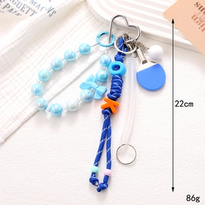 Colgante de bolso de cuerda azul con raqueta de ping pong y cierre metálico de corazón