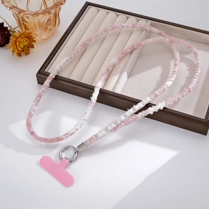 Detailed view of pink sequin denim woven phone crossbody strap with metal spring buckle