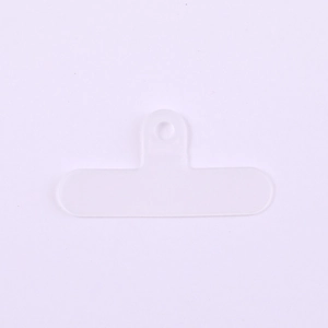 Close-up of a semi-transparent purple PVC phone tether tab with a metal ring hole