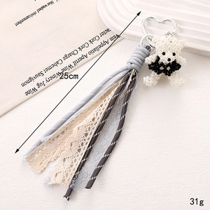 Handmade pearl bear bag charm with lace fringe and heart-shaped metal clip