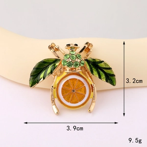 Detailed size view of retro enamel bee pin with citrus design at 3.2cm by 3.9cm