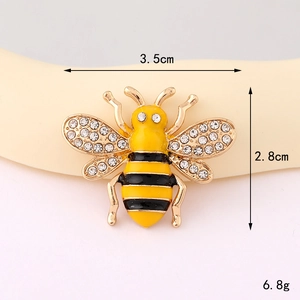 Vintage bee charm with yellow enamel and rhinestones measuring 3.5cm by 2.8cm
