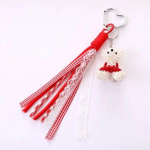 Handmade pearl bear bag charm with red bow and heart clasp for women's accessory