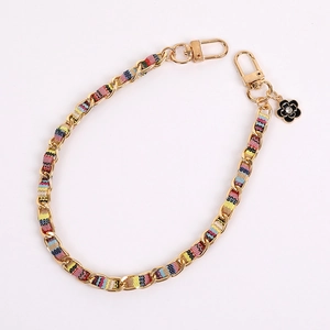 Golden metal chain with colorful ribbon and black camellia pendant for handbags