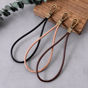 Retro leather wrist straps in black and brown with antique bronze metal hooks for bags